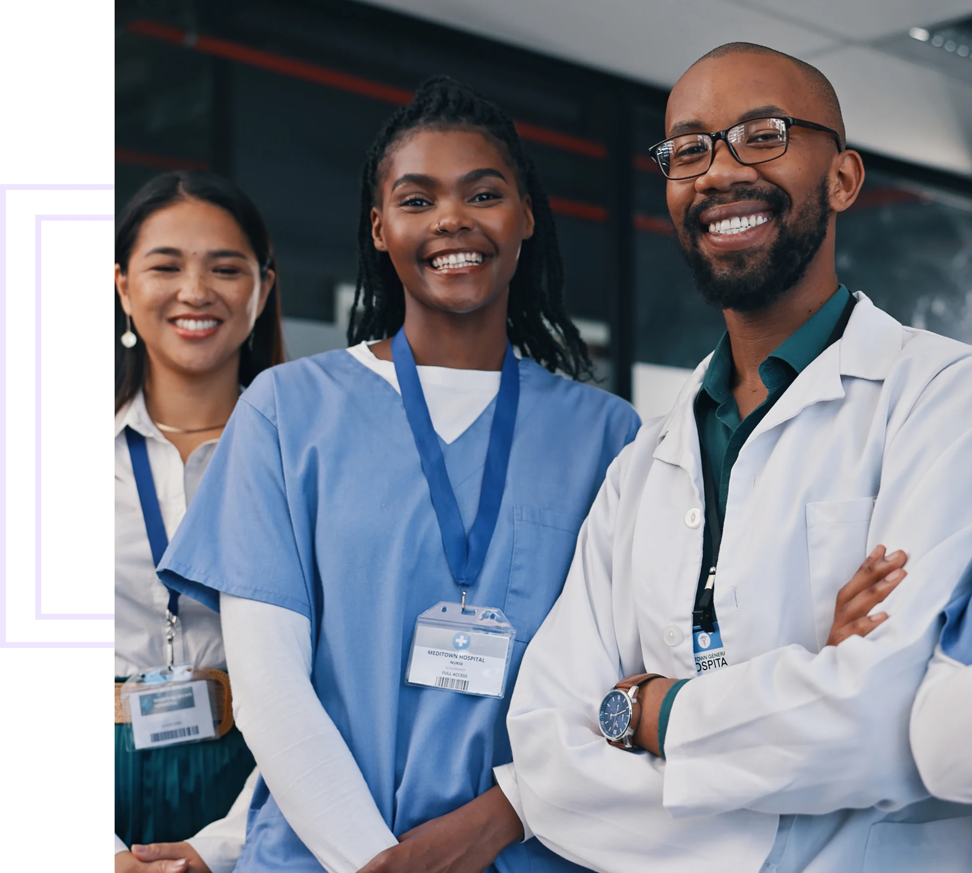 Healthcare professionals smiling in a hospital setting.