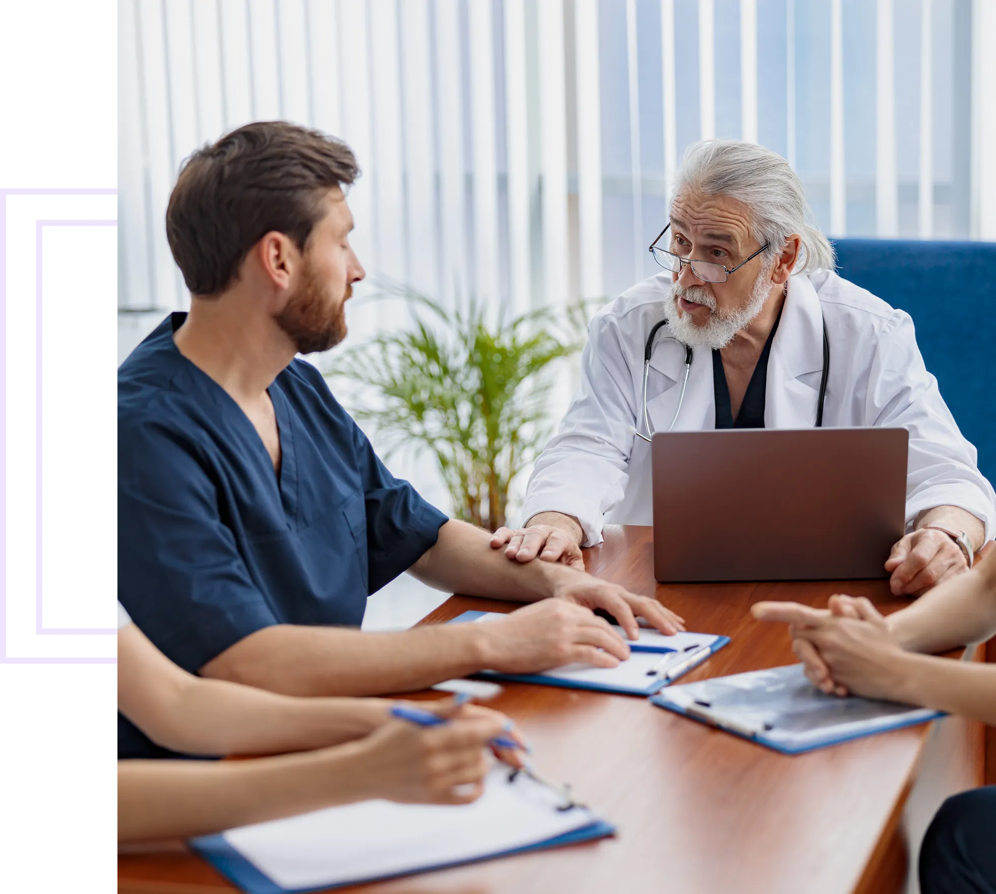 Doctors discussing at a conference table.