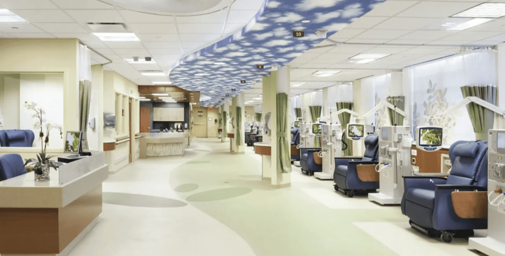 A spacious, modern hospital corridor with exercise equipment.